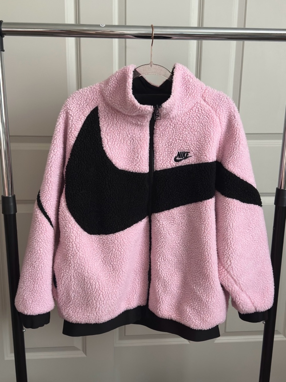 Nike Pink Teddy 

Stylish reversible Nike jacket.